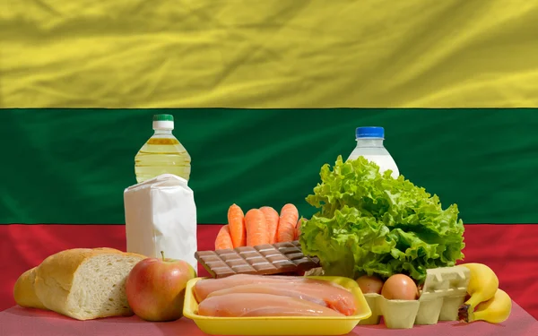 Basic food groceries in front of lithuania national flag — Stock Photo, Image