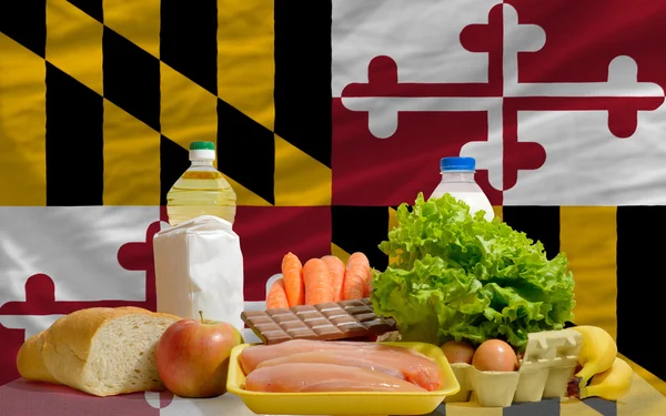 Basic food groceries in front of maryland us state flag — Stock Photo, Image