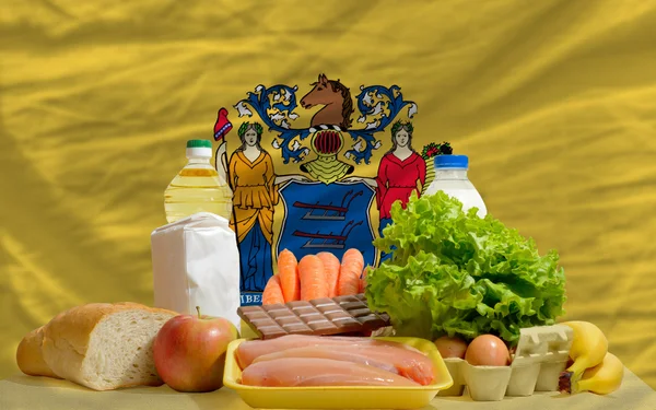 Basic food groceries in front of new jersey us state flag — Stock Photo, Image