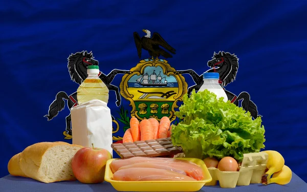 Basic food groceries in front of pennsylvania us state flag — Stock Photo, Image