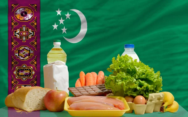 Basic food groceries in front of turkmenistan national flag — Stock Photo, Image