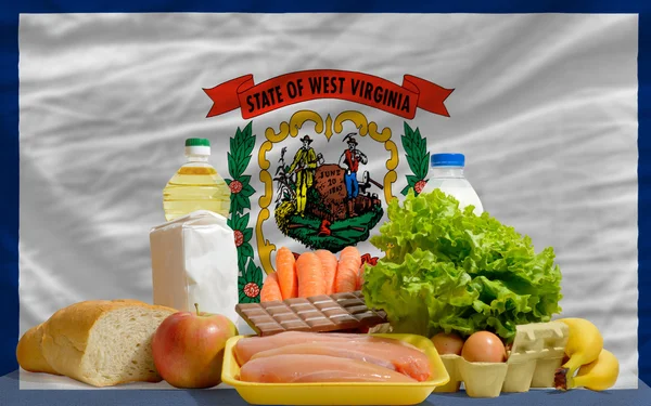 Basic food groceries in front of west virginia us state flag — Stock Photo, Image