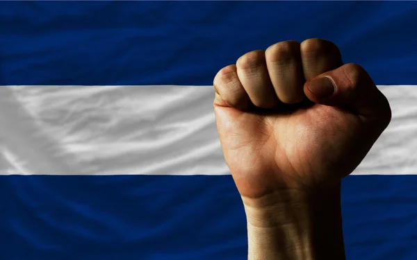 Hard fist in front of nicaragua flag symbolizing power — Stock Photo, Image