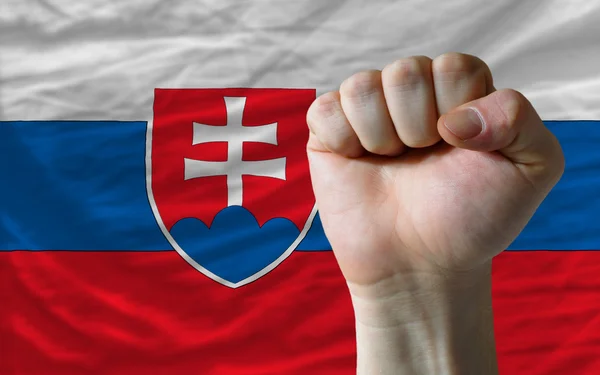Puño duro frente a la bandera de Eslovaquia que simboliza el poder — Foto de Stock