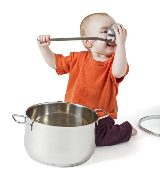 Baby with big cooking pot — Stock Photo, Image