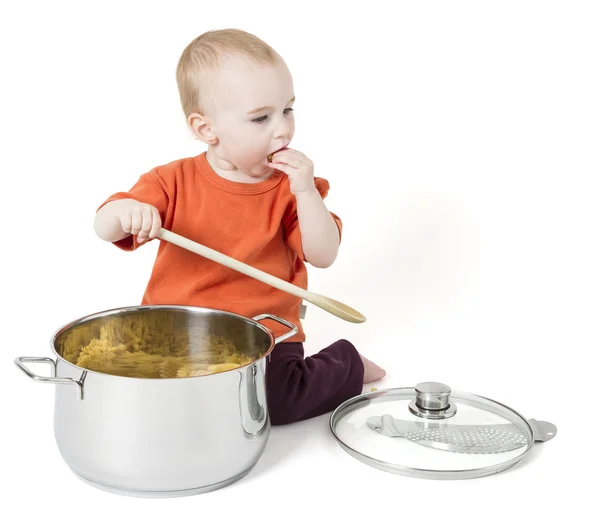 Baby with big cooking pot — Stock Photo, Image