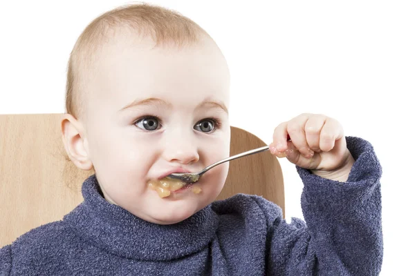 Bambino mangiare salsa di mele — Foto Stock