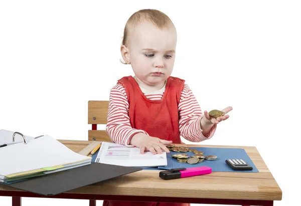 Young child at writing desk Stock Picture
