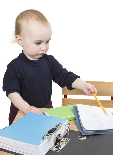 Young child at writing desk — Stock Photo, Image