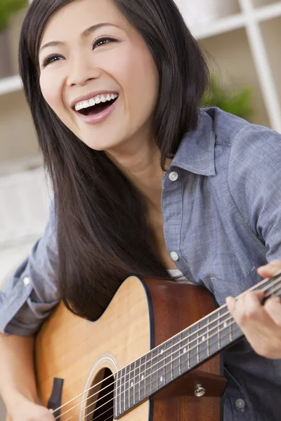 Beautiful Happy Chinese Oriental Asian Woman Smiling & Guitar Royalty Free Stock Images