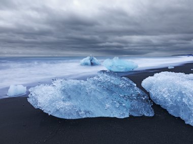 Ice blocks along coastline in iceland clipart