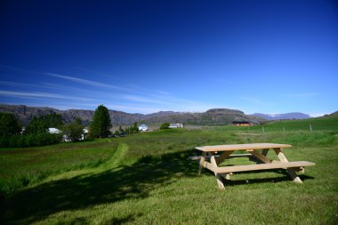 Outdoor bench in a farm clipart