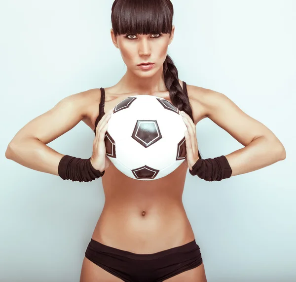 stock image Portrait of a hot young female holding a soccerball