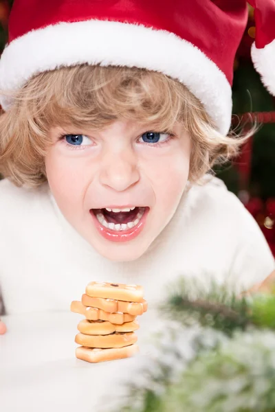 Funny child in Santa's hat — Stock Photo, Image