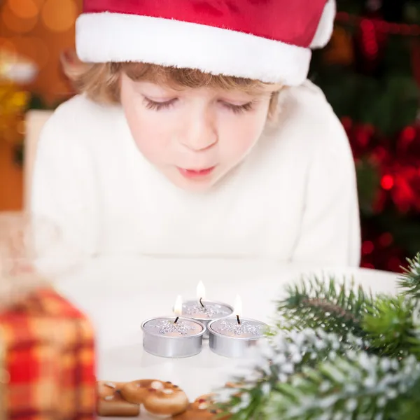 Funny child in Santa's hat — Stock Photo, Image