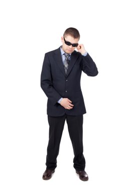 Security guard wearing a suit and sunglasses isolated on white b clipart