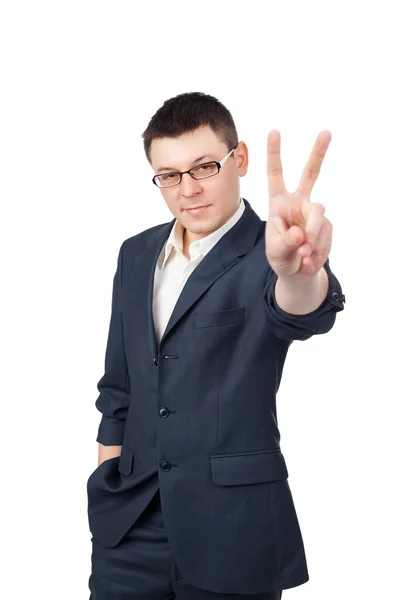 Retrato de un joven hombre de negocios mostrando signo de victoria aislado en —  Fotos de Stock