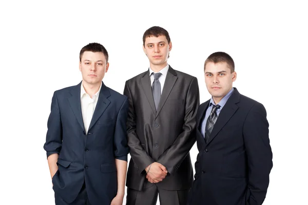 Tres jóvenes hombres de negocios de pie aislados sobre fondo blanco —  Fotos de Stock