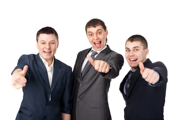 Tres hombres de negocios jóvenes riendo y dando el pulgar hacia arriba signo — Foto de Stock