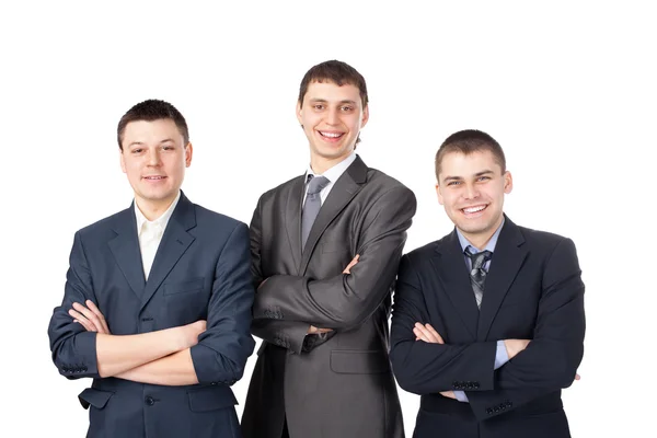 Tři mladý, usměvavý podnikání muži stojící se sepjatýma rukama izolovaných na květi — Stock fotografie