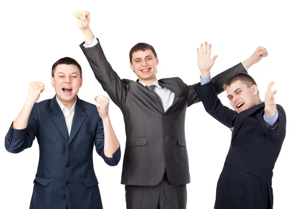 Jovens empresários bem sucedidos levantando as mãos isoladas no branco — Fotografia de Stock
