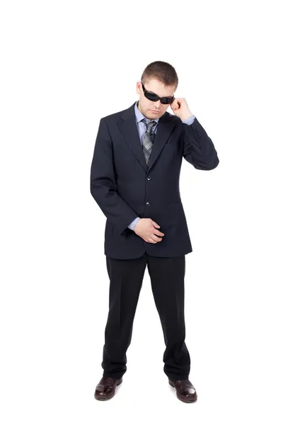 Säkerhetsvakt som bär kostym och solglasögon isolerad på vita b — Stockfoto