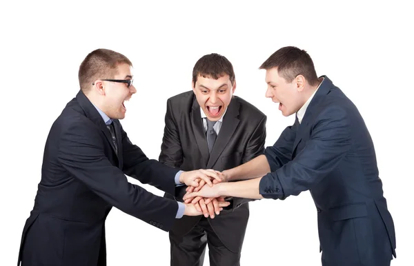 Három nevető partnerek üzembe a kezét a tetején, elszigetelt — Stock Fotó