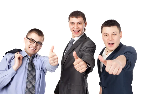 Tres hombres de negocios jóvenes riendo y dando el pulgar hacia arriba signo — Foto de Stock