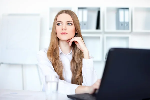 Portrait of beautiful young pensive business woman working on a — Stock Photo, Image