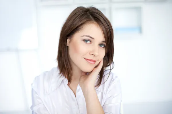 Portrait of pretty young business woman at office — Stock Photo, Image