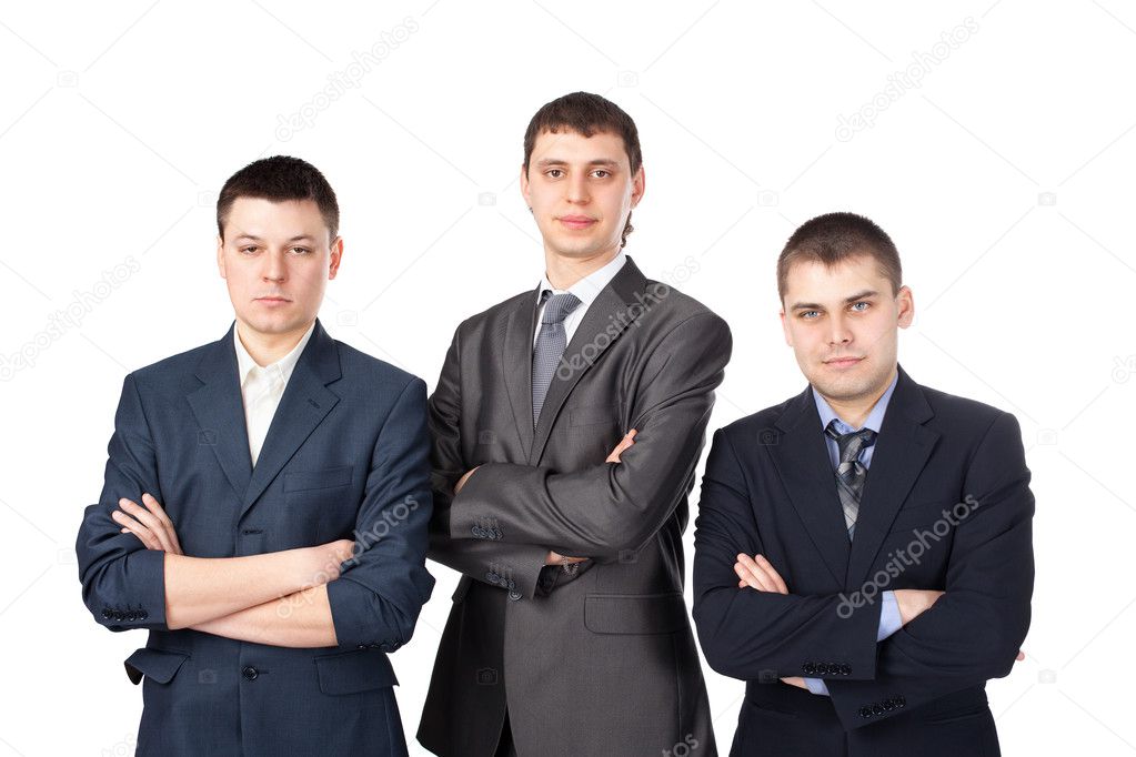Three young business men standing with folded hands isolated on