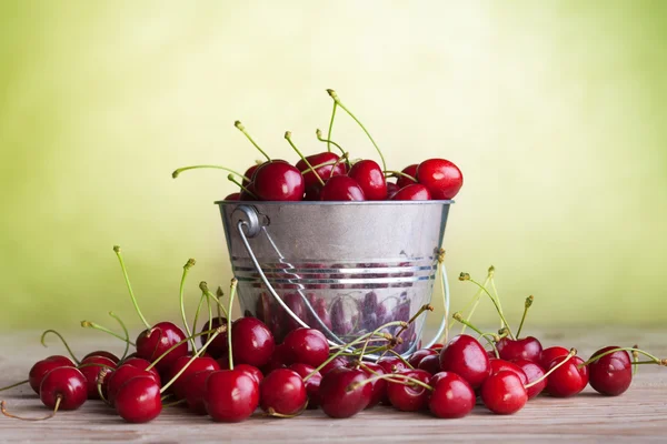 stock image Lots of cherries on old table