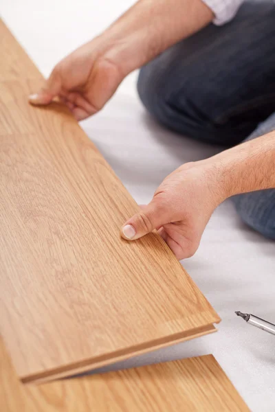 Laying laminate flooring - closeup — Stock Photo, Image