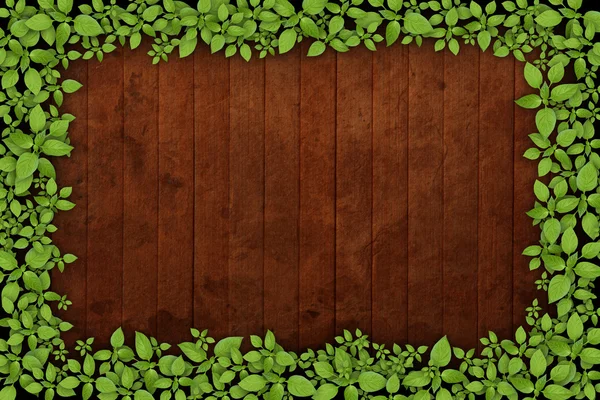Old wooden background with green floral frame — Stock Photo, Image