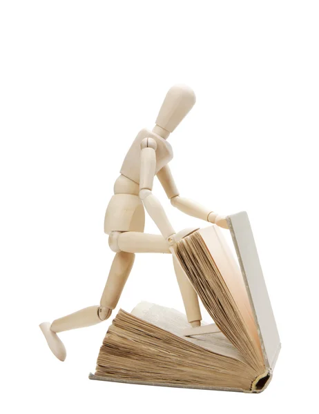 Hombre y libro de madera — Foto de Stock