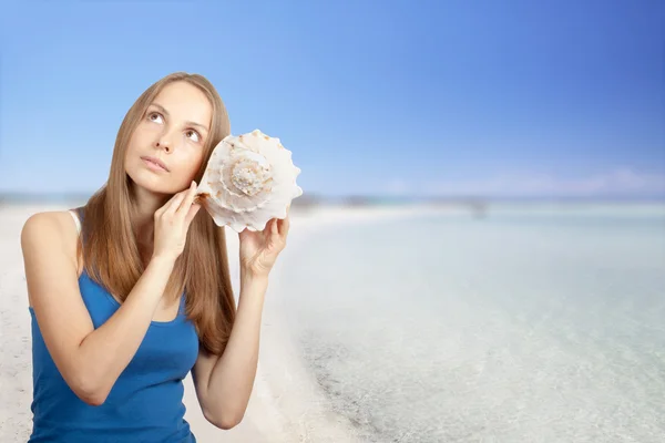 Sea and Woman listening conch — Stock Photo, Image