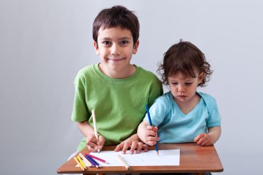 Little boys drawing together clipart