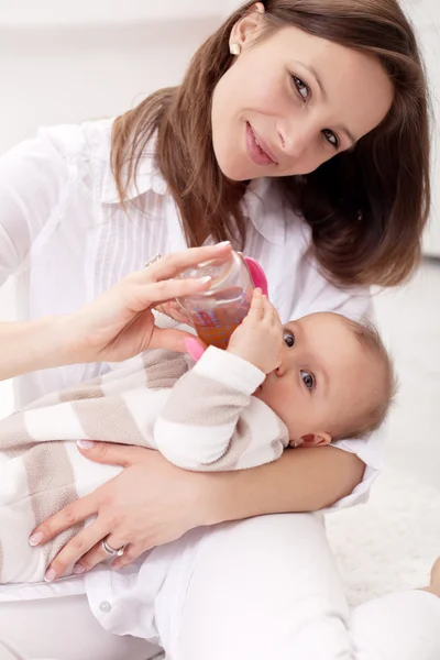 Baby girl held by her mother — Stock Photo, Image