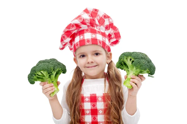 Menina chef pequeno feliz com brócolis — Fotografia de Stock