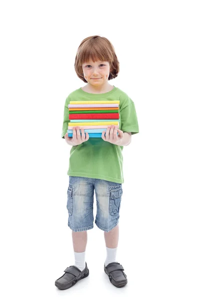 Хлопчик з різнокольоровими книгами — стокове фото