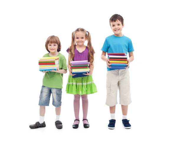 Kids prepared for school - holding colorful books stacks — Stock Photo, Image
