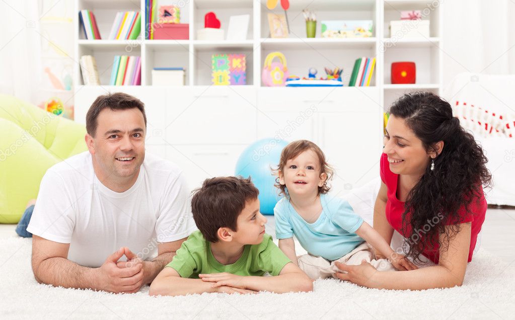 Young family playing in the kids room