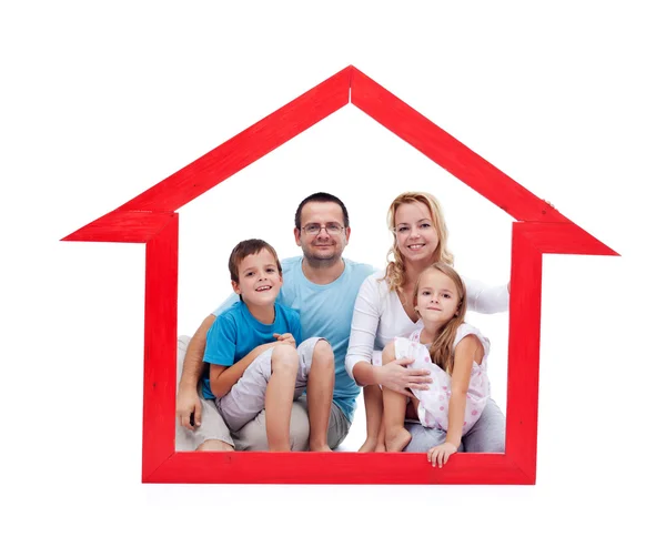 Família feliz com crianças em seu conceito de casa — Fotografia de Stock