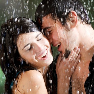 Young couple hugging under a rain clipart