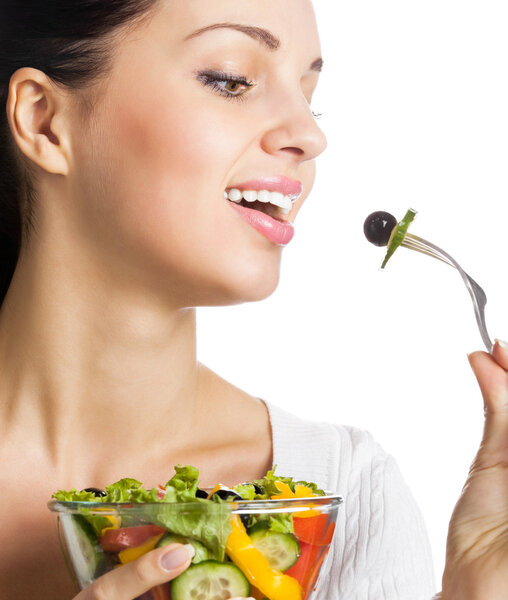 Smiling woman with salad, on white