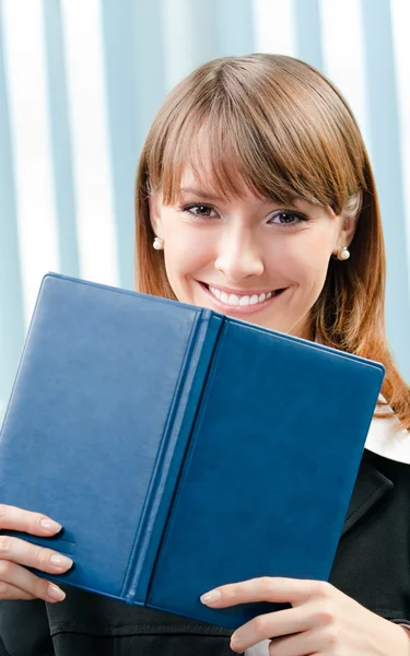 Young businesswoman with organizer at office — Stock Photo, Image