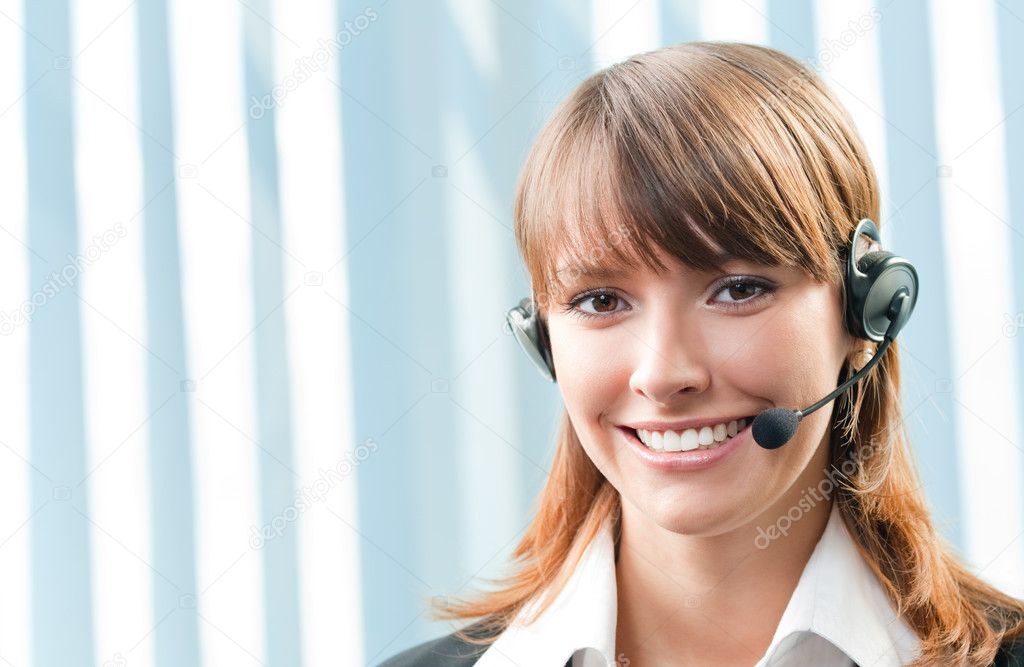 Cheerful smiling support phone operator at office
