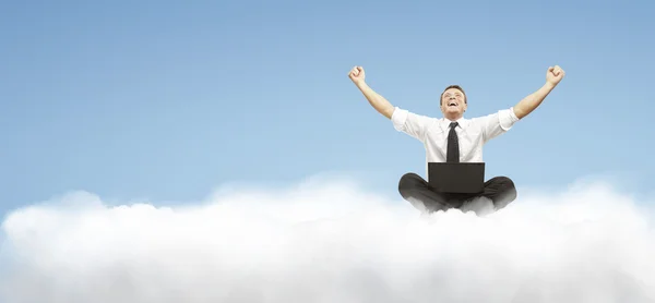 Homme d'affaires sur un nuage — Photo