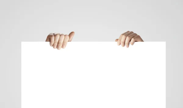 Papel em branco na mão — Fotografia de Stock