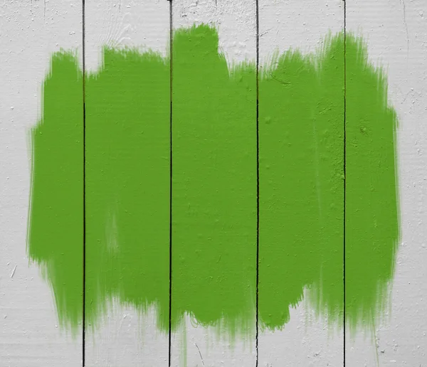 Tinta verde em madeira — Fotografia de Stock